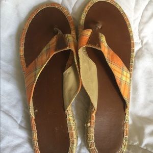 Orange and yellow flip flops